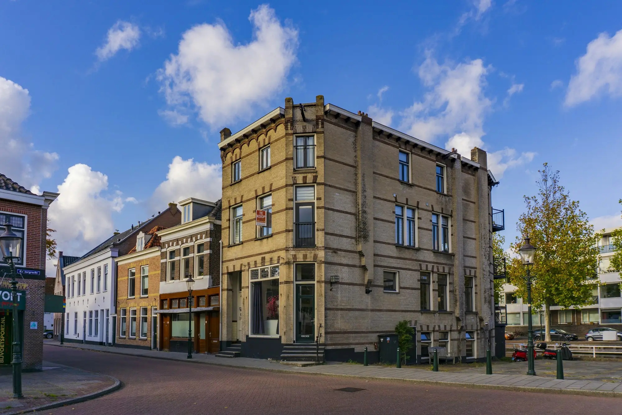 Brown concrete commercial building under a blue sky