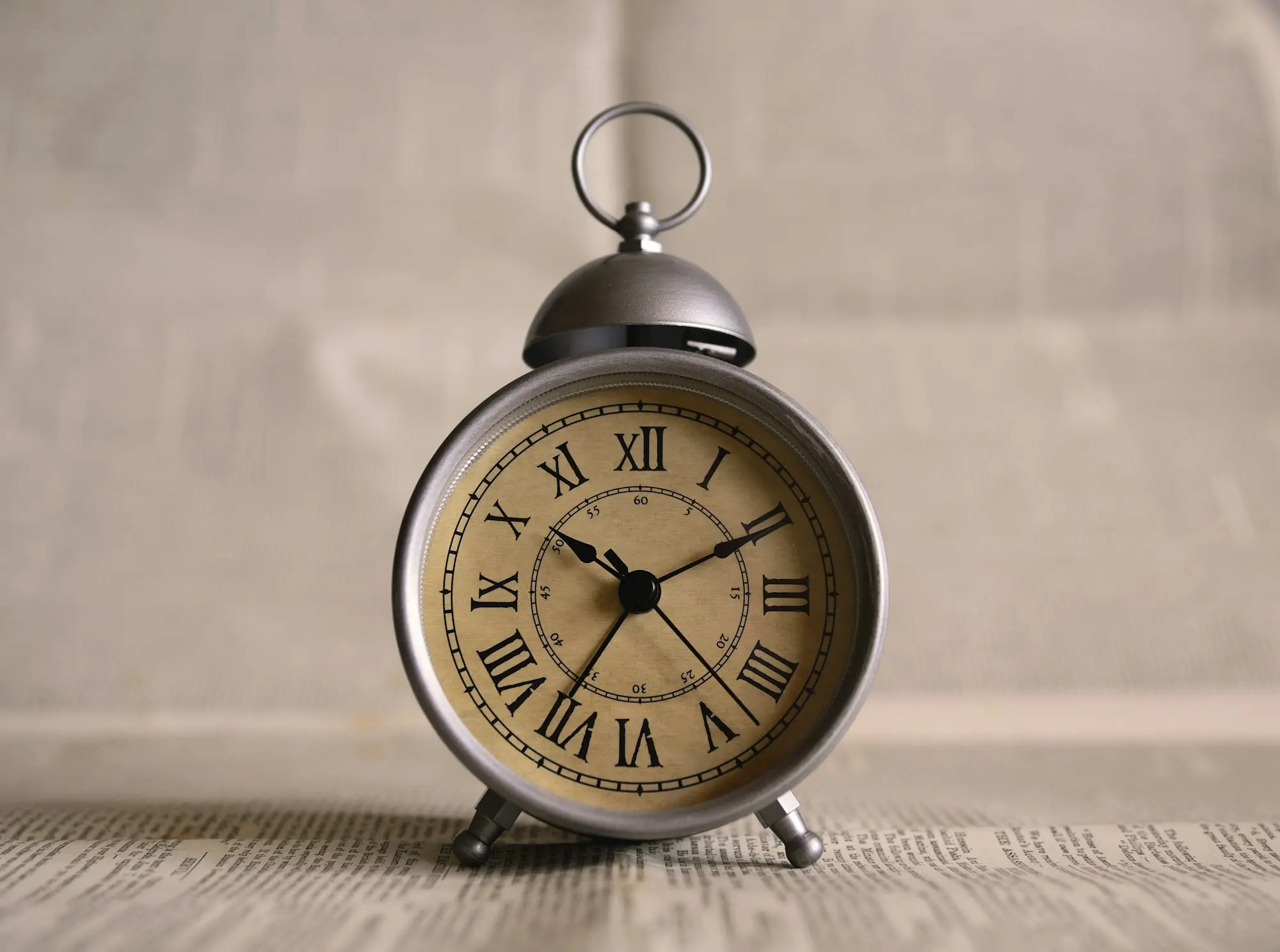 Alarm clock display showing 10:11, the time running on a deadline